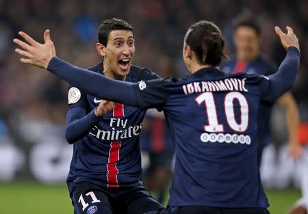 Football Soccer - Olympique Marseille v Paris St Germain - French Ligue 1 - Velodrome stadium, 07/02/2016, Paris St Germain's Angel Di Maria (L) reacts with team mate Zlatan Ibrahimovic after scoring against Olympique Marseille REUTERS/Jean-Paul Pelissier