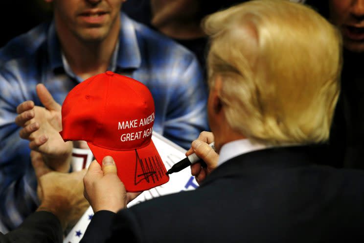 Trump signs a hat for a supporter after speaking at a campaign rally in Albany, N.Y., on April 11, 2016. (Eduardo Munoz Alvarez/Getty Images)