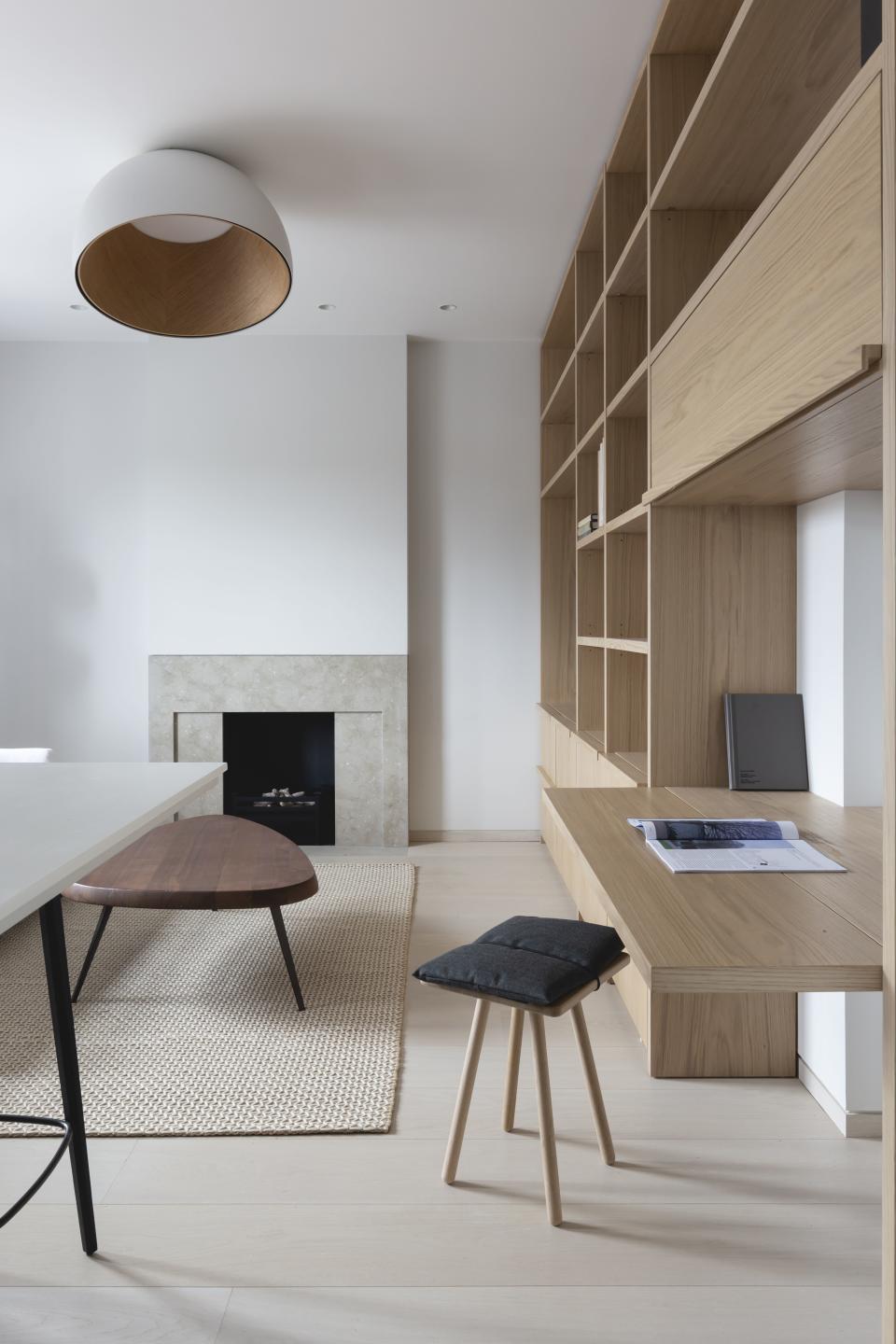 Living room with built in shelving and folding desk