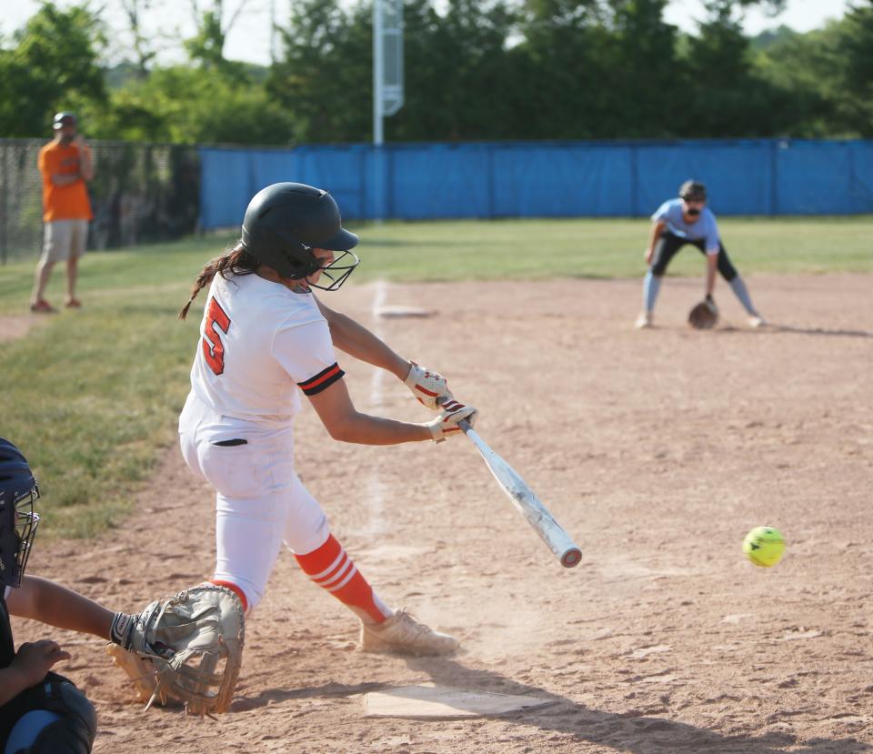 Marlboro's Elizabeth Leduc hits a walk off RBI single to win  the Class B Subregional softball game versus Rye Neck on May 30, 2023. 