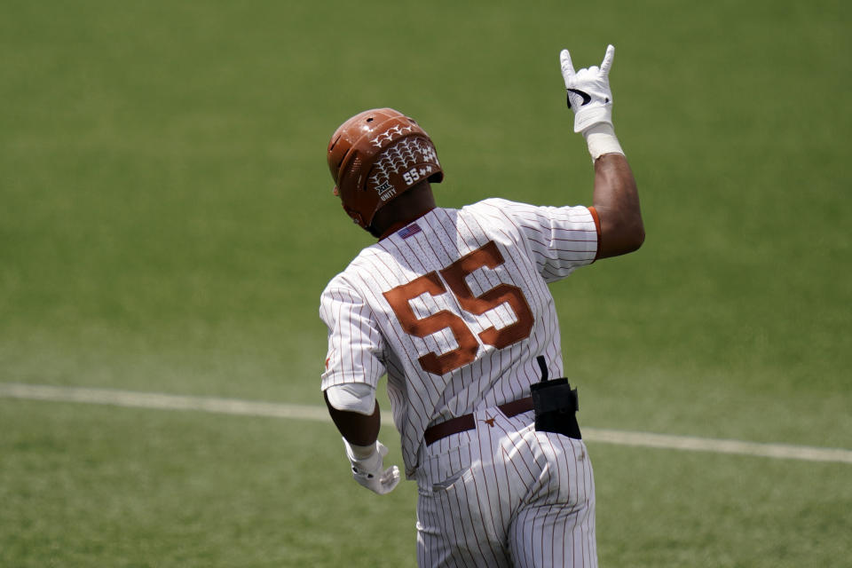 Texas' Camryn Williams celebrates a two-run home run against Southern as he rounds the bases during the eighth inning of an NCAA regional tournament college baseball game, Friday, June 4, 2021, in Austin, Texas. (AP Photo/Eric Gay)
