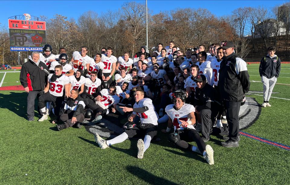 Rye players celebrate after defeating Port Jervis 28-14 during the NYSPHSAA Class B regional final football game at Goshen High School, Nov. 18, 2023.