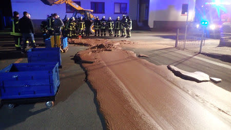 Spilt chocolate is seen on a road in Werl, Germany December 10, 2018 in this picture obtained from social media. Picture taken December 10, 2018. FEUERWEHR WERL/via REUTERS