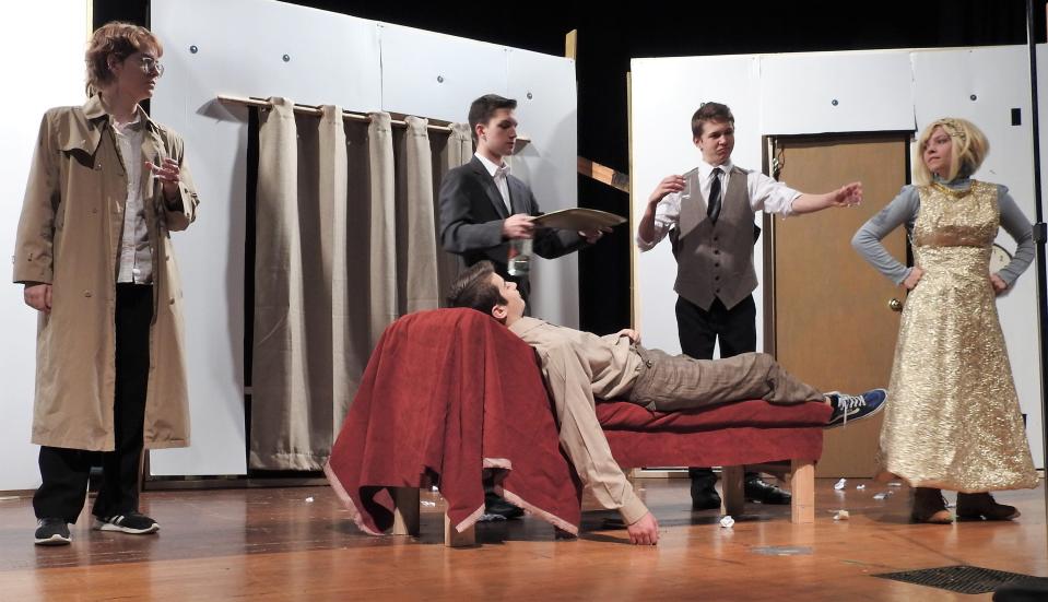 Kennedy Kittell, John Stamper, Jacob Miletti, Caden Griffiths and Olivia Crouso rehearse a scene for "The One-Act Play That Goes Wrong" opening at Coshocton High School. Each student was asked to pick a little nugget that defines their character and pin their performance on it.