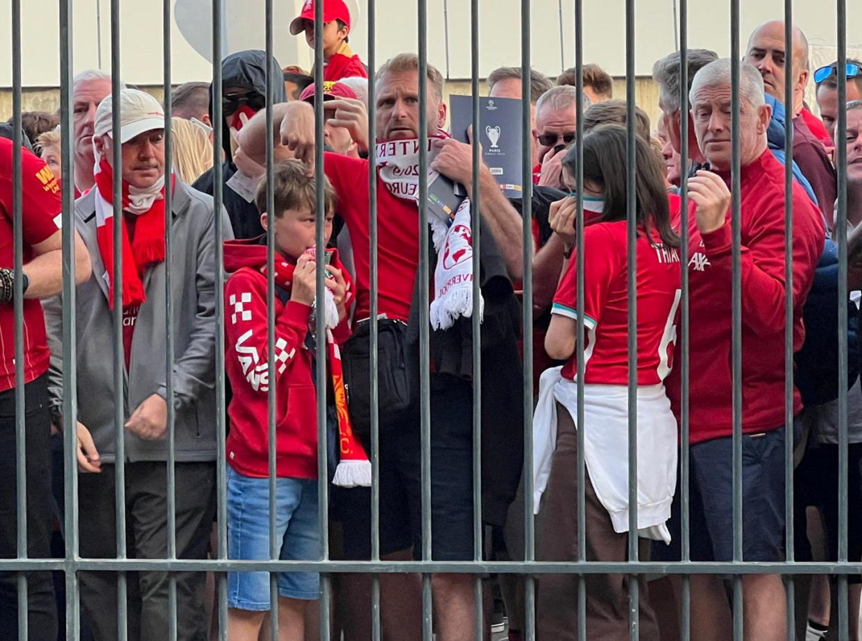 Soccer Football - Champions League Final - Liverpool v Real Madrid - Stade de France, Saint-Denis near Paris, France - May 28, 2022 Liverpool fans react as they queue to access Stade de France before Champions League Final   REUTERS/Fernando Kallas