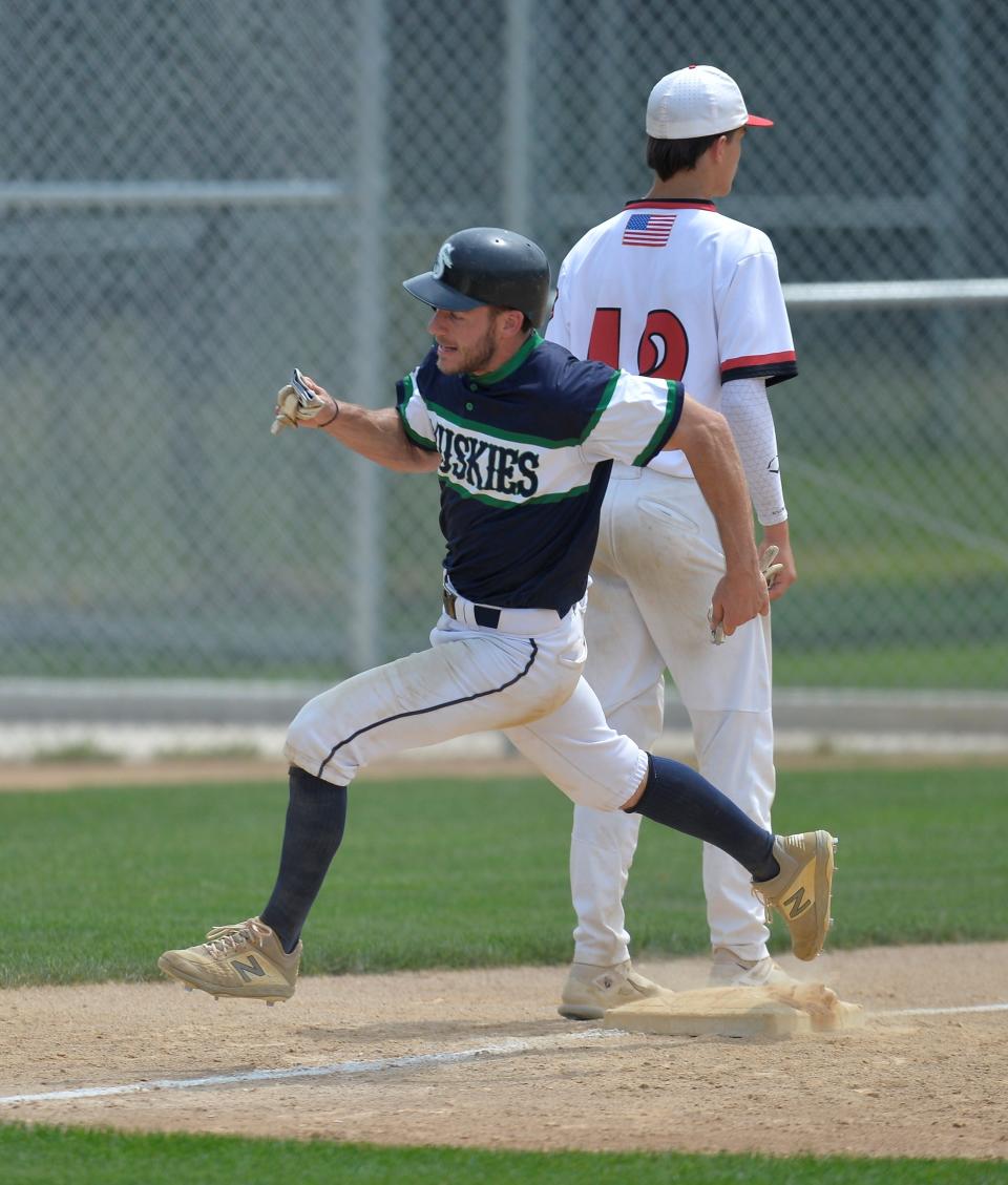 Sartell's Adam Schellinger rounds third base and heads home to score as the Sartell Muskies host the Sauk Rapids Cyclones at St. Cloud Orthopedics Field on Saturday, July 16, 2022.