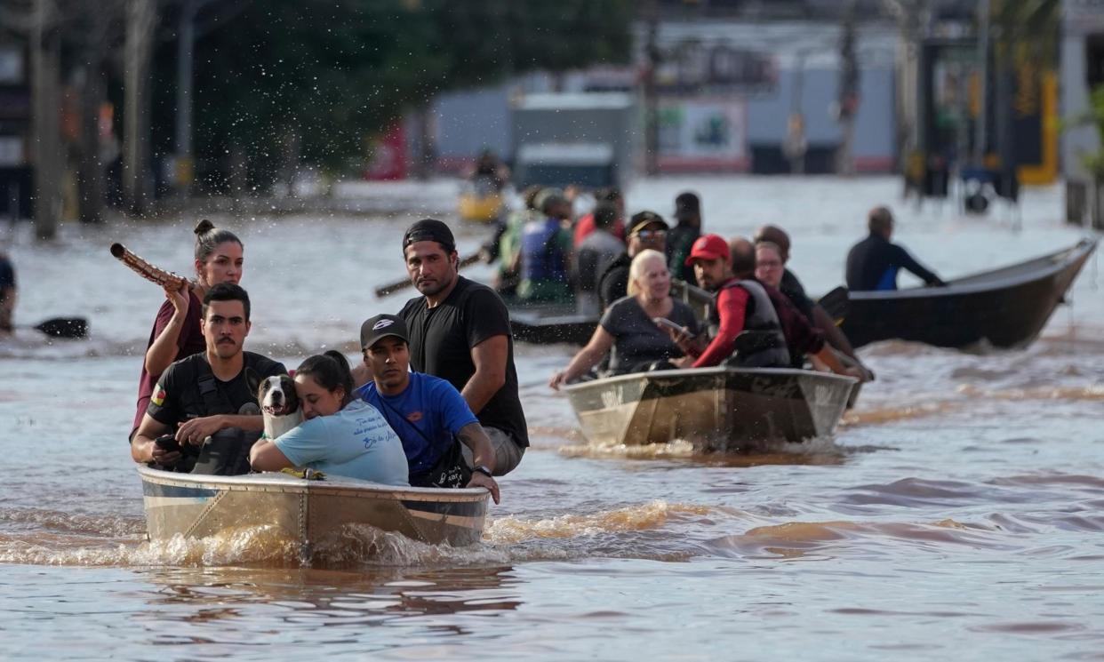 <span>Flooding in Porto Alegre was caused by devastating torrents and has killed at least 95 people.</span><span>Photograph: André Penner/AP</span>