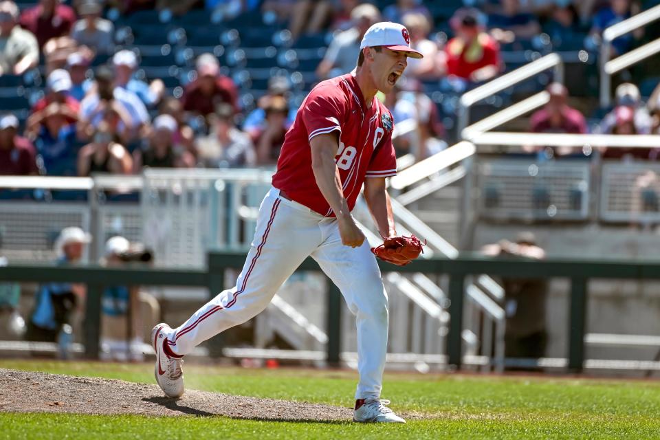 Jun 22, 2022; Omaha, NE, USA; Oklahoma Sooners starting pitcher David Sandlin (28) reacts after pitching against the Texas A&M Aggies in the seventh inning at Charles Schwab Field. Mandatory Credit: Steven Branscombe-USA TODAY Sports