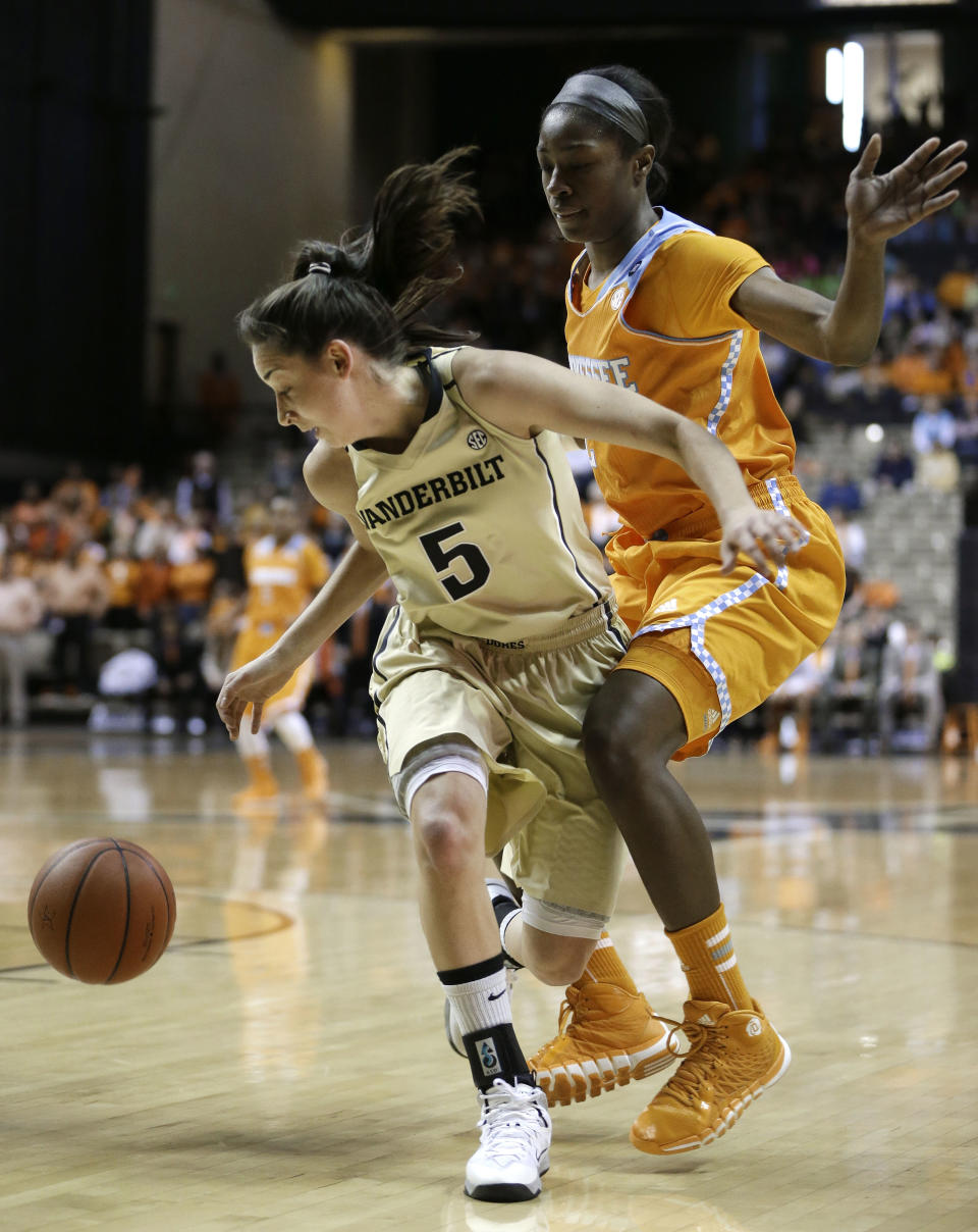 Vanderbilt guard Kady Schrann (5) is defended by Tennessee's Jasmine Jones in the first half of an NCAA college basketball game, Sunday, Jan. 12, 2014, in Nashville, Tenn. (AP Photo/Mark Humphrey)