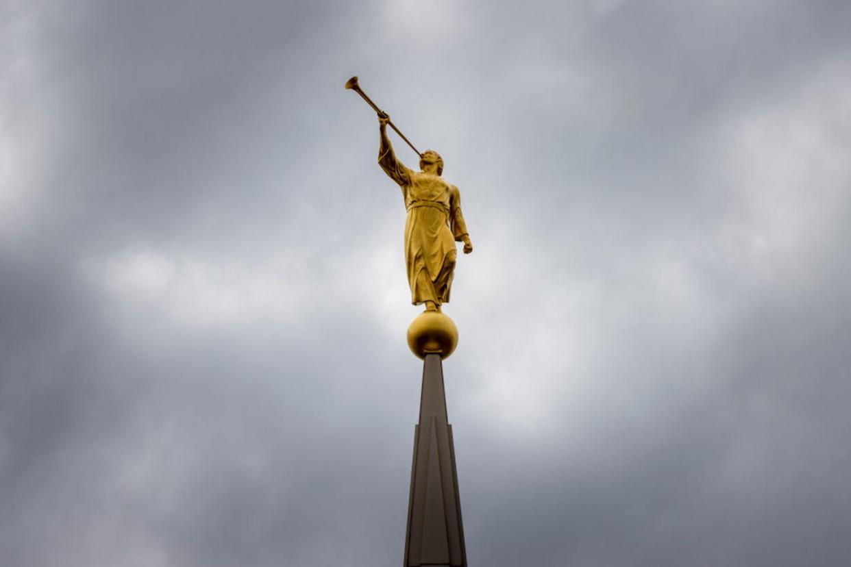 A golden sculpture of the angel Moroni atop the temple of the Church of Jesus Christ of Latter-day Saints in Rexburg, Idaho. <a href="https://www.gettyimages.com/detail/news-photo/golden-sculpture-of-an-angel-moroni-is-seen-atop-the-temple-news-photo/1253747353?adppopup=true" rel="nofollow noopener" target="_blank" data-ylk="slk:Natalie Behring/Getty Images;elm:context_link;itc:0;sec:content-canvas" class="link ">Natalie Behring/Getty Images</a>