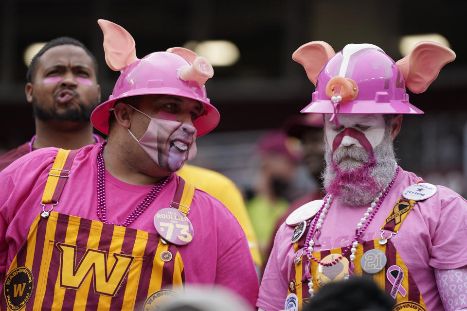 Washington Football Team fans watch the first half of an NFL football game against the New Orleans Saints, Sunday, Oct. 10, 2021, in Landover, Md. (AP Photo/Julio Cortez)