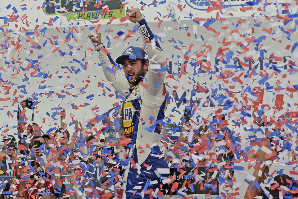 Chase Elliott celebrates in victory lane after winning the NASCAR Cup Series auto race at Charlotte Motor Speedway in Concord, N.C., Sunday, Sept. 29, 2019. (AP Photo/Gerry Broome)