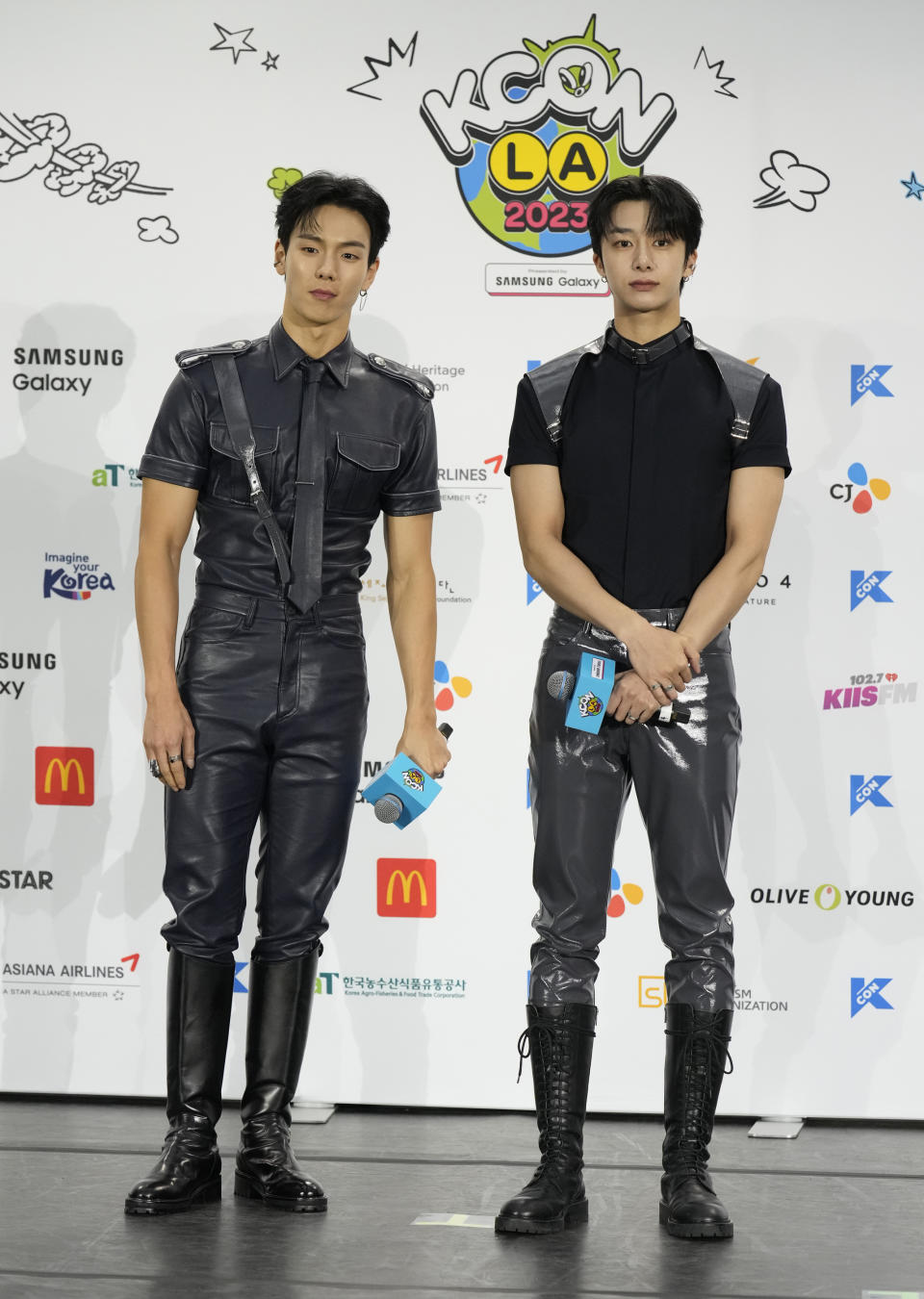 Shownu, left, and Hyungwon, of South Korean boy group Monsta X, attend KCON at the Los Angeles Convention Center on Friday, Aug. 18, 2023. (AP Photo/Chris Pizzello)