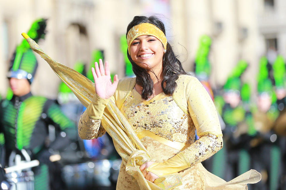 A member of The Ronald Reagan High School Marching Band from San Antonio, Texas waves to the spectators during the 93rd Macy’s Thanksgiving Day Parade. (Photo: Gordon Donovan/Yahoo News) 