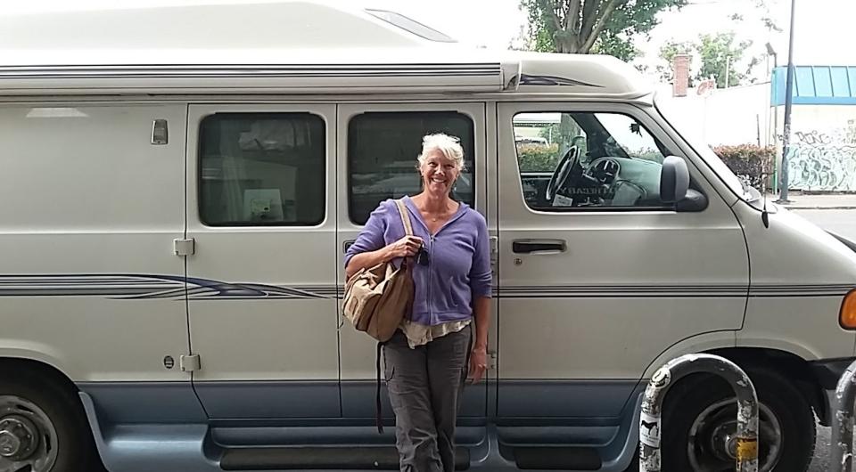 The author standing in front of her van, &ldquo;Roadcinante,&rdquo; in downtown Portland, Oregon (2017). (Photo: Courtesy of Dennise Kowalczyk)