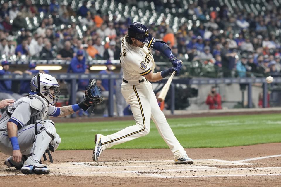 Milwaukee Brewers' Brian Anderson hits a two-run scoring double during the first inning of a baseball game against the New York Mets Tuesday, April 4, 2023, in Milwaukee. (AP Photo/Morry Gash)