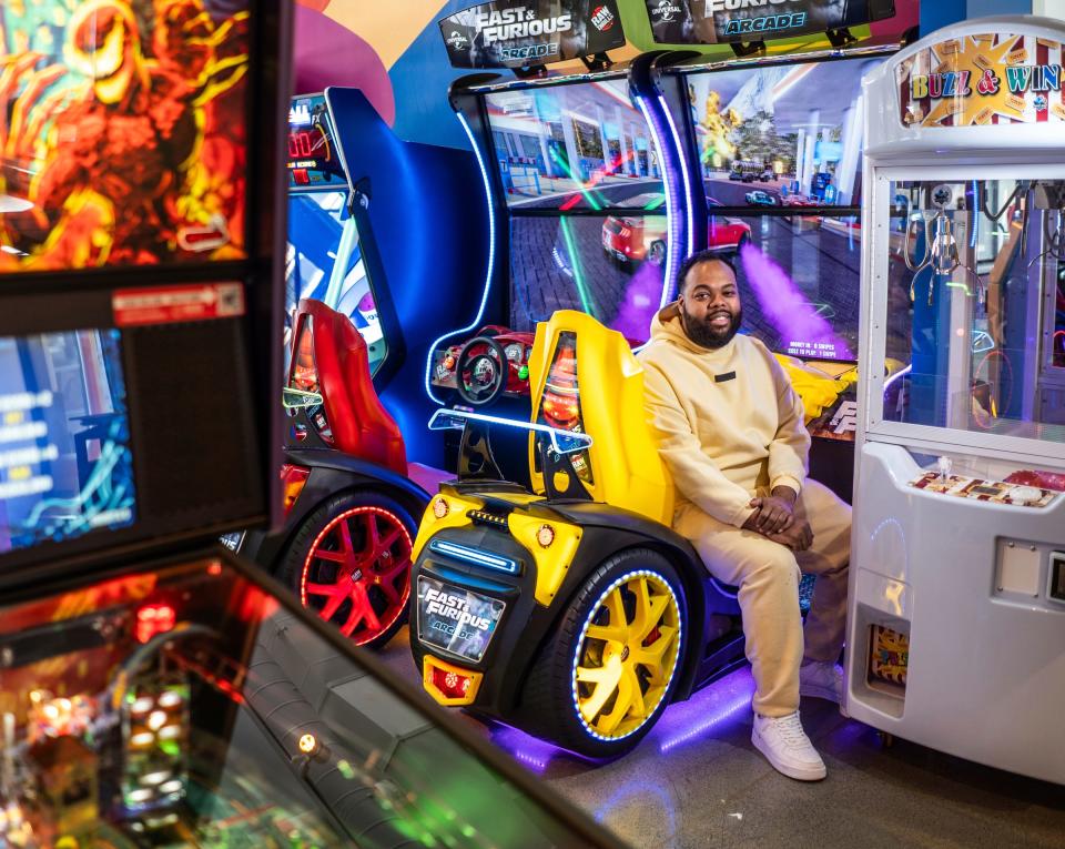RollerCade owner Kyle Black sits amongst a variety of arcade games as work continues before the opening of the new downtown Detroit location of Next Level by RollerCade on Monday, April 15, 2024, in time for the NFL draft.