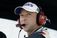 FILE - In this Monday, Aug. 3, 2009, file photo, Chad Knaus, crew chief for driver Jimmie Johnson, looks out over the track from their pit during the NASCAR Pennsylvania 500 auto race at Pocono Raceway in Long Pond, Pa. Chad Knaus will move off the pit stand and into a management role with Hendrick Motorsports, ending his crew chief career after seven championships. Hendrick on Tuesday, Sept. 29, 2020, announced Knaus will move to vice president of competition. (AP Photo/Carolyn Kaster, File)