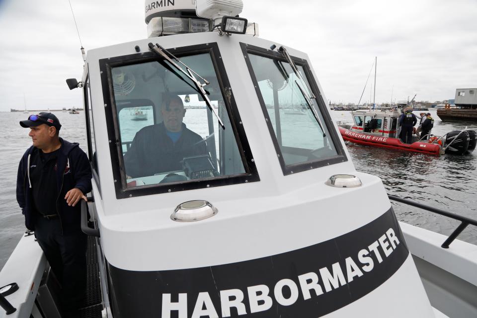 Travis Rebello, Haz-Mat coordinator, and Sgt. Paul Fonseca monitor an exercise conducted in New Bedford harbor by a joint force of local fire and police departments using a new set of radiation testing devices.