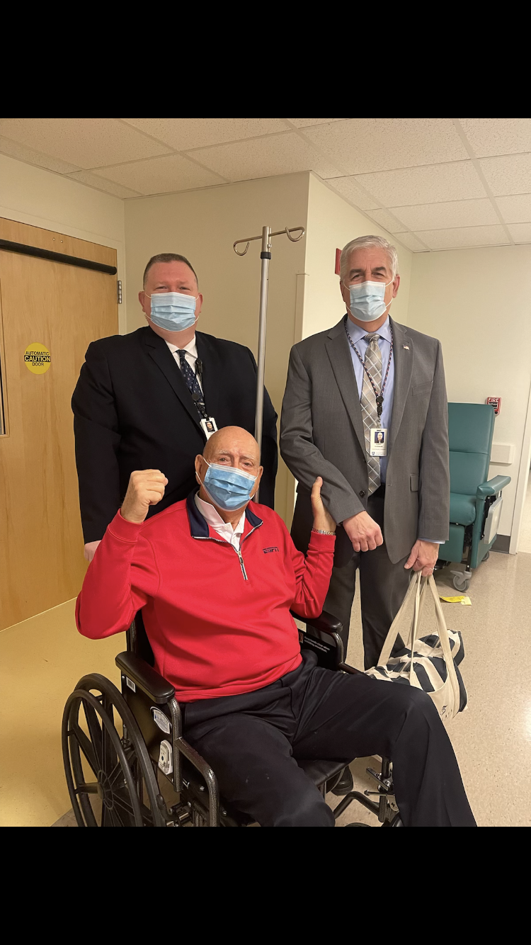 Dick Vitale and two members of Massachusetts General Hospital security on Tuesday after the 82-year-old ESPN college basketball analyst and Lakewood Ranch resident underwent vocal cord surgery.