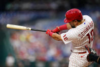 Philadelphia Phillies' Kyle Schwarber follows through after hitting a home run against Washington Nationals pitcher Josiah Gray during the fourth inning of a baseball game, Wednesday, July 6, 2022, in Philadelphia. (AP Photo/Matt Slocum)