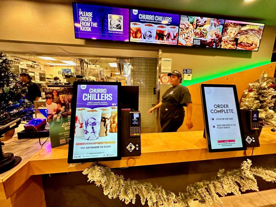 Menu boards and kiosks promote Taco Bell's new Churro Chillers.