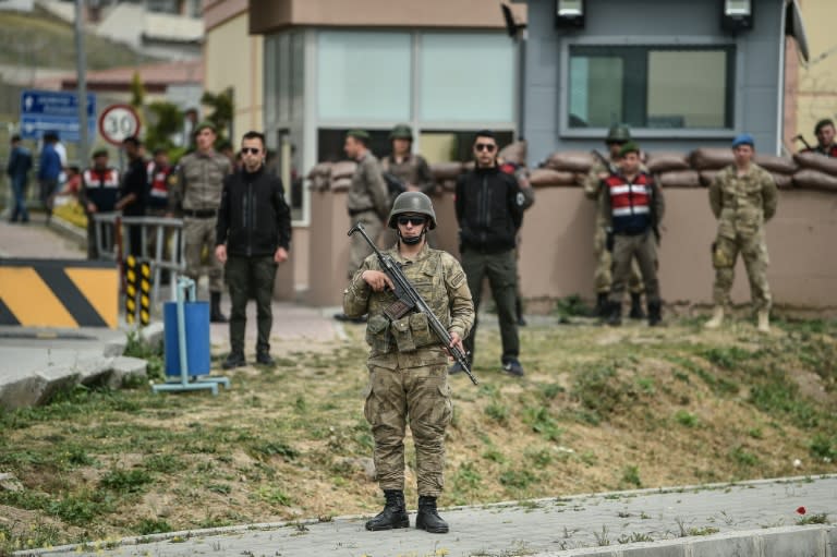 Turkish soldiers stand guard at the entrance of the Aliaga court and prison complex where the trial of American pastor Andrew Brunson on terror and spy charges resumed Monday