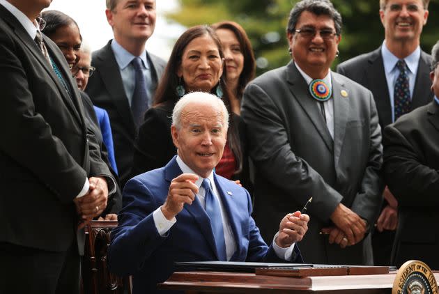 President Joe Biden finishes signing an executive order to expand the areas of three national monuments during an event at the White House on Friday. The Biden administration restored the areas of two Utah sites held sacred by several Native American tribes, Bears Ears National Monument and Grand Staircase-Escalante, as well as the Northeast Canyons and Seamounts monument off the New England coast, after former President Donald Trump opened them to mining, drilling and development during his time in office. (Photo: Chip Somodevilla via Getty Images)