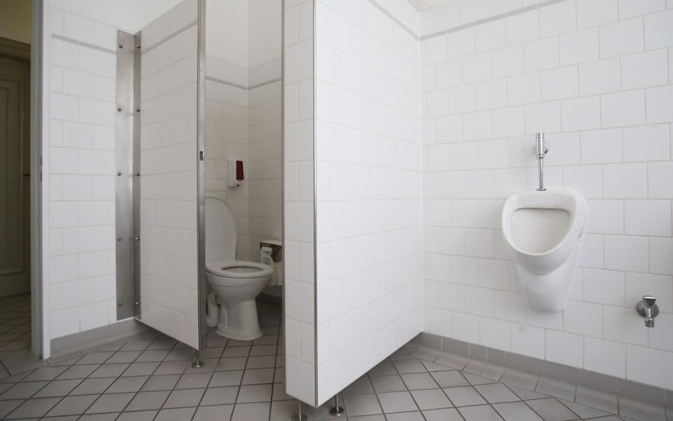 A toilet and a urinal stand in a newly-inaugurated gender-free toilet at the office building of the city's Senate Administration for Work, Integration and Women (Senatsverwaltung fuer Arbeit, Integration und Frauen) on November 24, 2015 in Berlin, Germany - Sean Gallup /Getty 