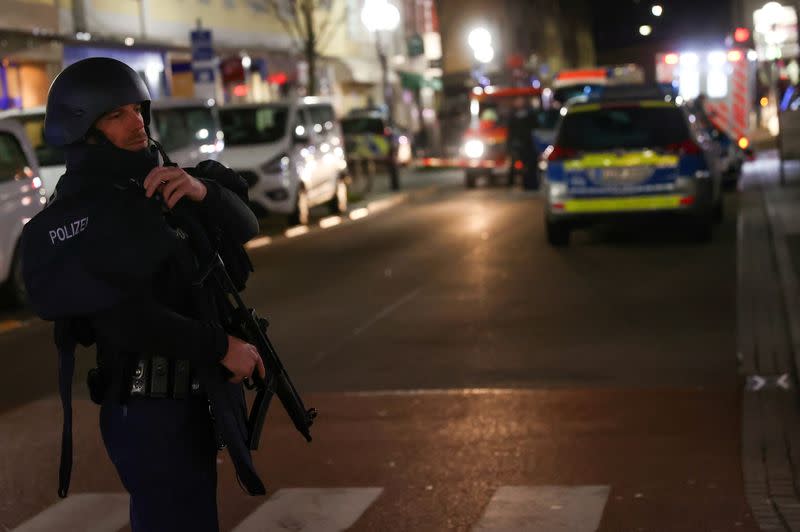 Police officers secure the area after a shooting in Hanau near Frankfurt