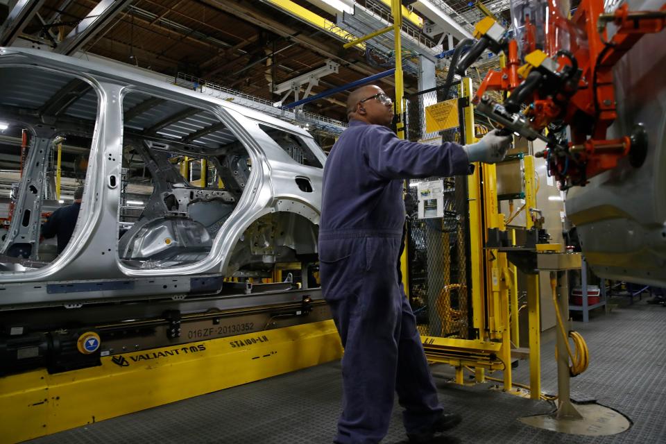 Workers assemble cars at the newly renovated Ford's Assembly Plant in Chicago, June 24, 2019. - The plant was revamped to build the Ford Explorer, Police Interceptor Utility and Lincoln Aviator. (Photo by JIM YOUNG / AFP)        (Photo credit should read JIM YOUNG/AFP via Getty Images)