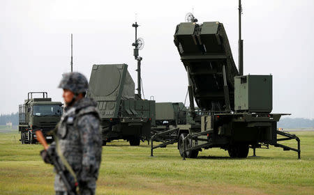 FILE PHOTO : A Japan Self-Defense Forces (JSDF) soldier takes part in a drill to mobilise their Patriot Advanced Capability-3 (PAC-3) missile unit in response to a recent missile launch by North Korea, at U.S. Air Force Yokota Air Base in Fussa on the outskirts of Tokyo, Japan August 29, 2017. REUTERS/Issei Kato/File Photo