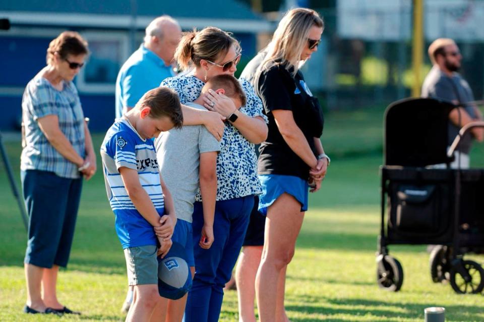 Before that evening’s baseball game, Garner Baseball Inc held a vigil for Miles Campbell and his parents Tyler and Susan in Garner, N.C., Tuesday, May 28, 2024. The Campbells were killed after an SUV driver ran a red light and collided with their vehicle on U.S. 70 Monday afternoon.