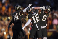 Minnesota defensive back Coney Durr (16) celebrates with teammates after stopping a Maryland play during the second half of an NCAA college football game Saturday, Oct. 23, 2021, in Minneapolis. (AP Photo/Stacy Bengs)