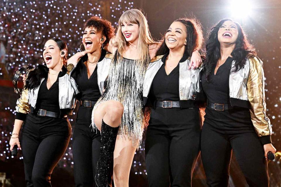 <p>Shirlaine Forrest/TAS24/Getty</p> Taylor Swift with her backup singers performing in Cardiff on June 18, 2024