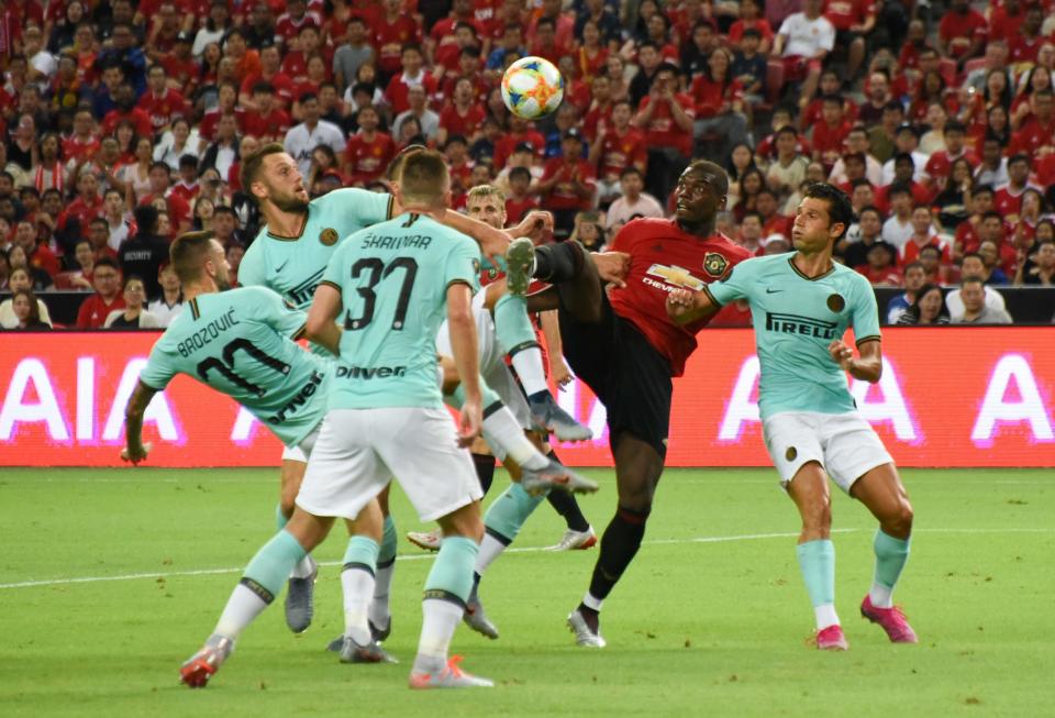 Manchester United's Paul Pogba (red jersey) fights for the ball with a few Inter Milan players during their International Champions Cup match at the National Stadium. (PHOTO: Zainal Yahya/Yahoo News Singapore)
