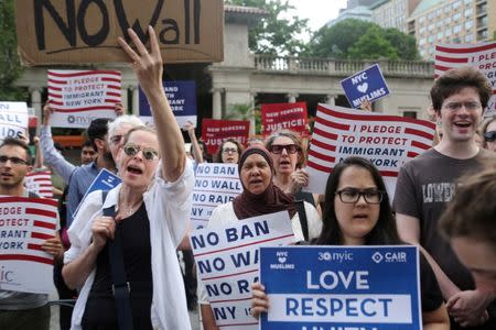 FILE PHOTO: Protesters chant slogans against U.S. President Donald Trump's limited travel ban, approved by the U.S. Supreme Court, in New York City, U.S., June 29, 2017. REUTERS/Joe Penney