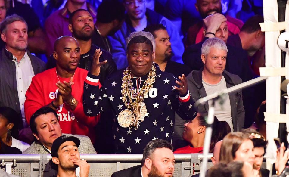 Charlamagne tha God and Tracy Morgan watch Terence Crawford defeat Amir Khan to win the WBO welterweight title in New York City on Saturday.