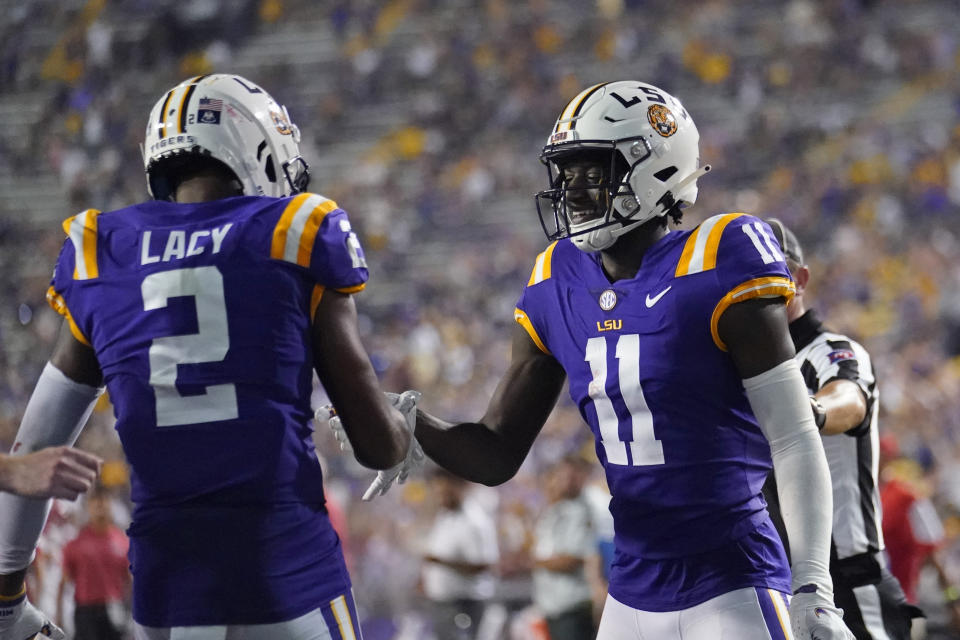 LSU wide receiver Brian Thomas Jr. (11) celebrates his touchdown reception with wide receiver Kyren Lacy (2) in the second half of an NCAA college football game against New Mexico in Baton Rouge, La., Saturday, Sept. 24, 2022. LSU won 38-0. (AP Photo/Gerald Herbert)