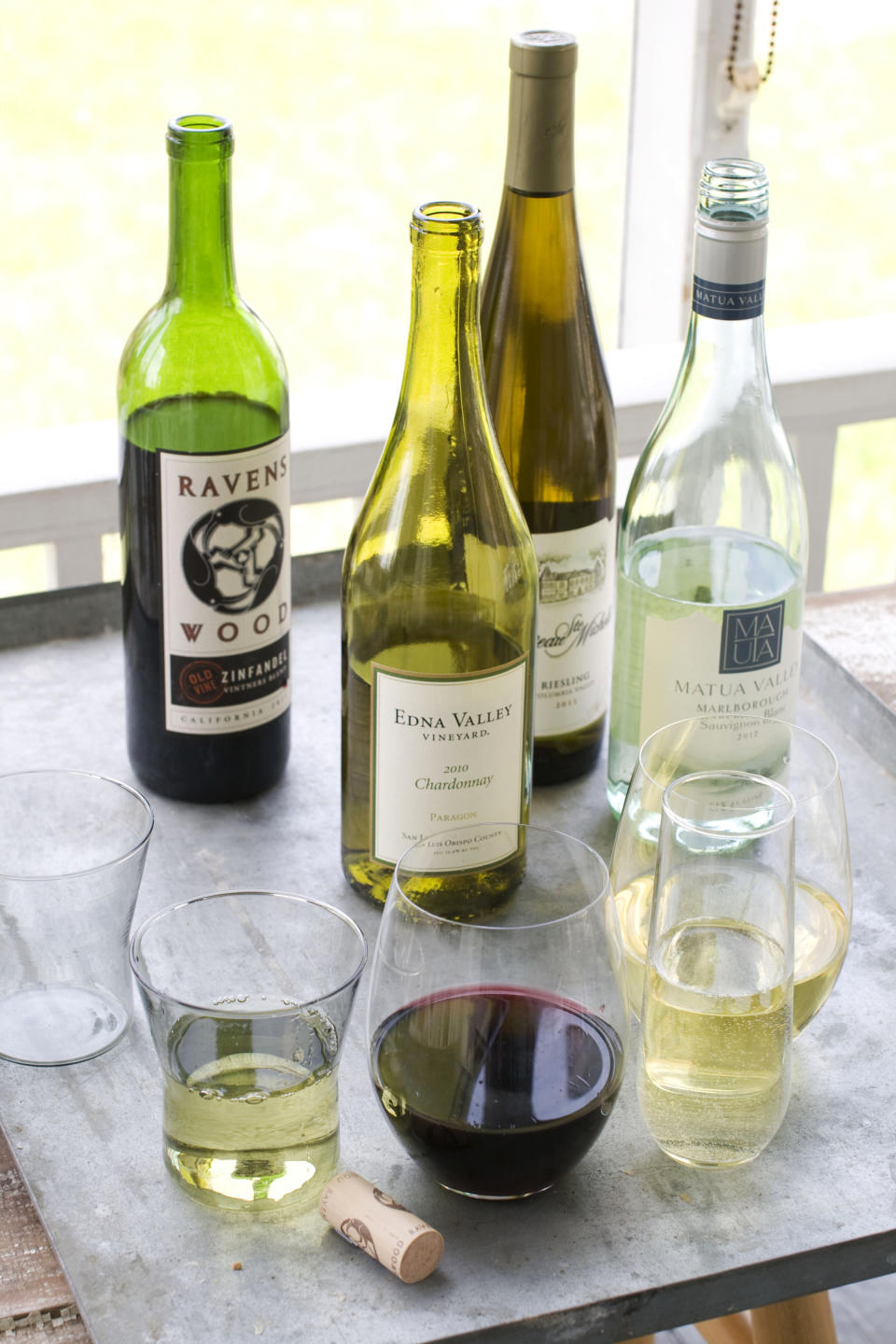 This image taken on April 29, 2013 shows, from left, Ravenswood Zinfandel, Edna Valley Chardonnay, Chateau St. Michelle Eroica Riesling and Matua Valley Sauvignon Blanc wines in Concord, N.H. (AP Photo/Matthew Mead)