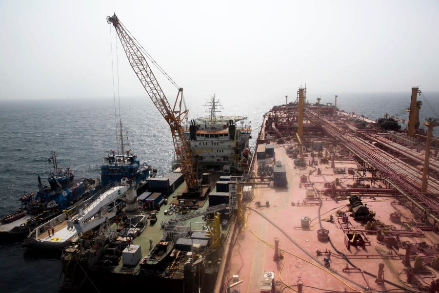 FILE – Technical vessels are seen by the decrepit Safer tanker on Monday, June 12, 2023, off the coast of Yemen. The Safer had posed an environmental threat since 2015, as it decayed and threatened to spill its contents of 1.14 million barrels into the Red Sea and Indian Ocean. After years of alarm and negotiations, the Safer’s oil was transferred onto another tanker in August. (AP Photo/Osamah Abdulrahman, File)