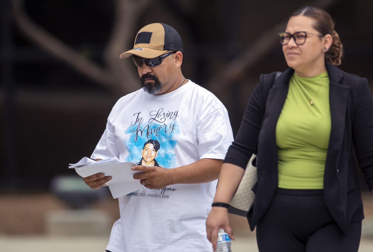 Francisco Rodriguez, left, wearing a T-shirt with an image of his son Javier Rodriguez, who was killed in the Walmart mass shooting leaves the federal court in El Paso, Texas, Thursday, July 6, 2023. Nearly four years after a white gunman killed 23 people at a Walmart in El Paso in a racist attack that targeted Hispanic shoppers, relatives of the victims are packing a courtroom near the U.S.-Mexico border this week to see Patrick Crusius punished for one of the nation's worst mass shootings. (AP Photo/Andrés Leighton)