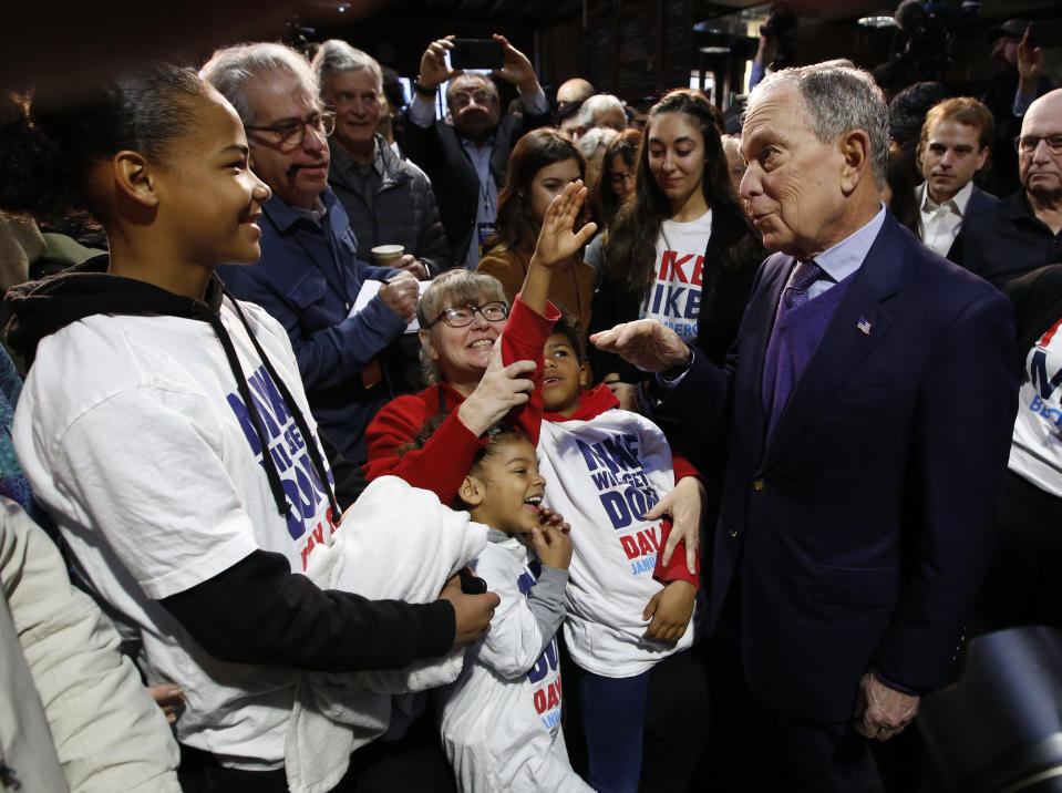 Democratic presidential candidate and former New York City Mayor Michael Bloomberg, right, talks with supporters during a campaign stop in Sacramento, Calif., Monday, Feb. 3, 2020. (AP Photo/Rich Pedroncelli)