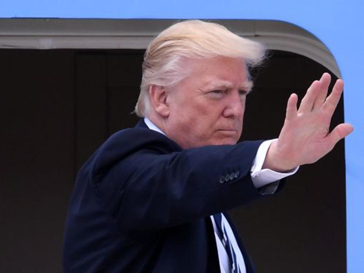 Donald Trump waves before boarding Air Force One: Reuters