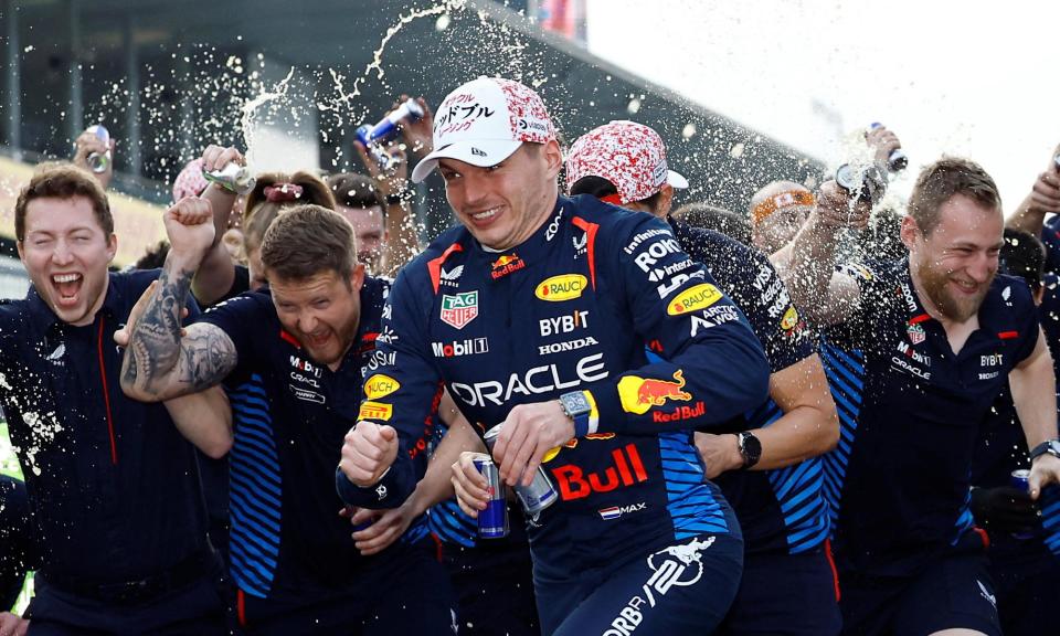 <span>Red Bull's Max Verstappen celebrates with his team after winning the Japanese Grand Prix.</span><span>Photograph: Issei Kato/Reuters</span>