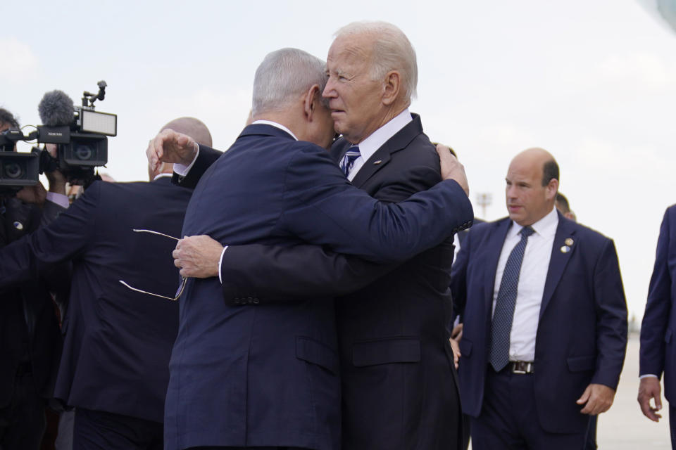 President Biden is greeted with an embrace by Israeli Prime Minister Benjamin Netanyahu after arriving at Ben Gurion International Airport.
