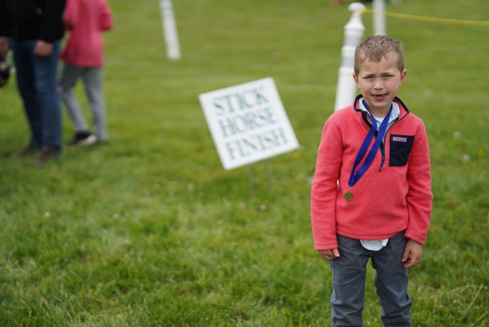 Winner of the 5-7 Stick Horse race, Sam Steel 6-year-old, poses with his medal