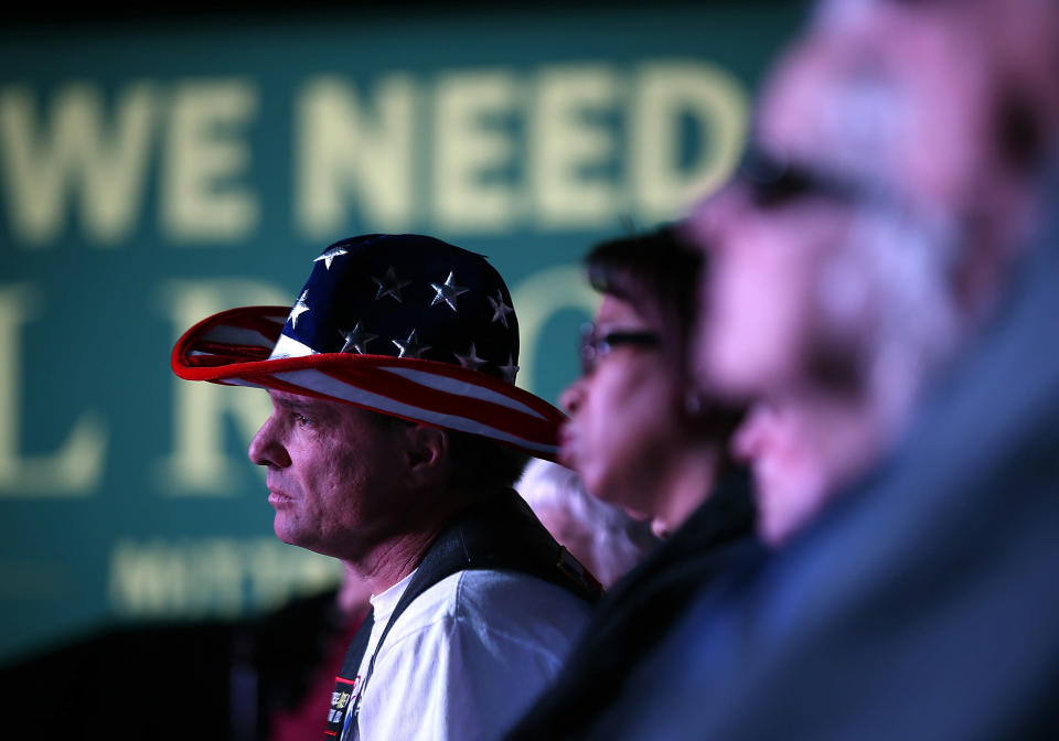 A supporter of Republican presidential candidate, former Massachusetts Gov. Mitt Romney wears a patriotic cowboy hat during a campaign rally at the Reno Event Center on October 24, 2012 in Reno, Nevada. (Photo by Justin Sullivan/Getty Images)