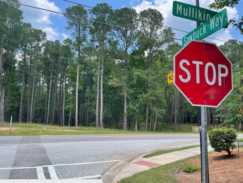 Sawbuck Way meets Mullikin Road in Evans, showing property in the background being proposed to construct the Timber Creek subdivision.