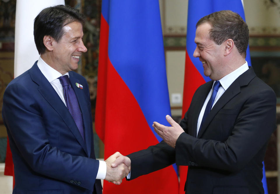 Russian Prime Minister Dmitry Medvedev, right, shakes hands with Italian Premier Giuseppe Conte during a meeting in Moscow, Russia, Wednesday, Oct. 24, 2018. Italian Prime Minister Giuseppe Conte is holding talks with Russian officials on his first trip to Moscow. (Dmitry Astakhov, Sputnik, Kremlin Pool Photo via AP)